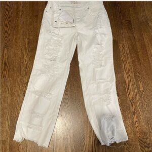 Free people white distressed, button fly, straight leg, raw hem jeans.